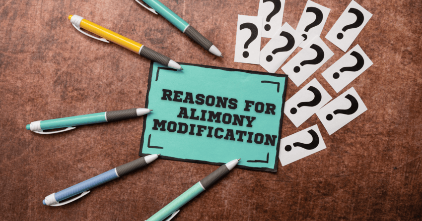 Question mark symbols and few pens lying around a card which reads reasons for alimony modification.