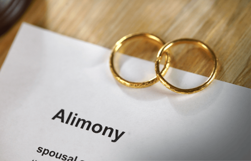 A document of alimony order with two rigs placed on top, demonstrating spousal support modification in California.